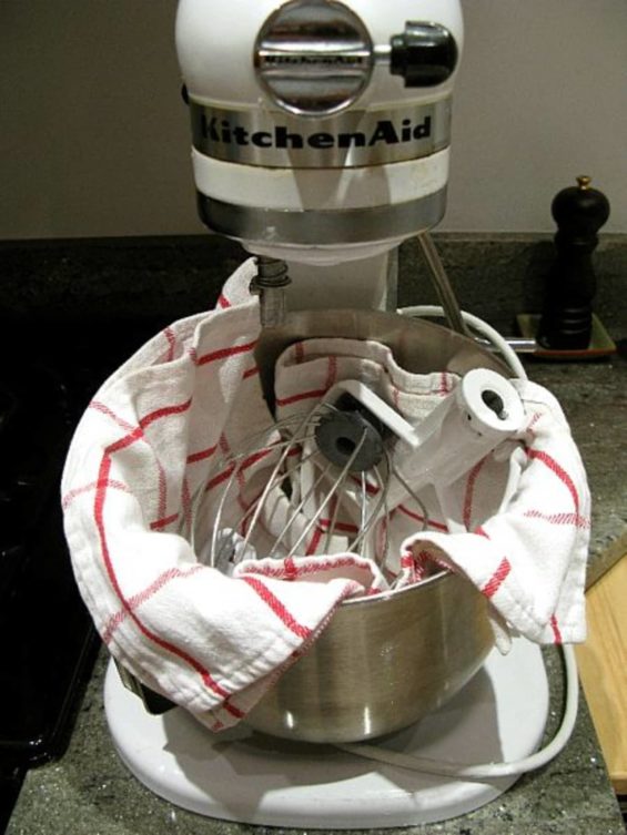 Mixer attachments stored in a towel placed inside the bowl